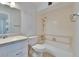 Bathroom with toilet, tub, shower, and a vanity with updated faucet at 1531 Council Dr, Sun City Center, FL 33573