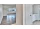 Sunlit living room featuring grey wood flooring and neutral paint at 1531 Council Dr, Sun City Center, FL 33573