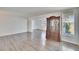 Spacious living area featuring gray wood floors, cabinet, and natural light at 1531 Council Dr, Sun City Center, FL 33573