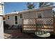 Small backyard with a white lattice fence and exterior of a gray home at 1736 14Th N St, St Petersburg, FL 33704