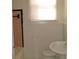 Functional bathroom featuring a sink, toilet, and pink tiled bathtub at 1736 14Th N St, St Petersburg, FL 33704