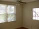 Bright bedroom with windows, fan and door to outside at 1736 14Th N St, St Petersburg, FL 33704