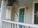 Close-up of the front door, painted blue, with the house number 1736 visible above at 1736 14Th N St, St Petersburg, FL 33704