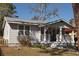 Charming single-story home with a cozy front porch and well-maintained landscaping at 1736 14Th N St, St Petersburg, FL 33704