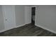 Empty room with gray walls and modern wood-look floors at 1736 14Th N St, St Petersburg, FL 33704