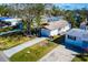 A beautiful home, lush lawn, and a long driveway, captured from an aerial view at 1826 Nevada Ne Ave, St Petersburg, FL 33703