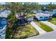 Charming single-story home with mature trees in the front yard and driveway at 1826 Nevada Ne Ave, St Petersburg, FL 33703