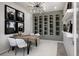 Unique dining room space featuring decorative wine rack and modern lighting at 18483 Green Garden Ct, Venice, FL 34293