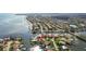 Aerial view of waterfront homes with boat docks and lush landscaping in a coastal neighborhood at 1930 Kansas Ne Ave, St Petersburg, FL 33703