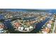 Stunning aerial view of waterfront neighborhood with boat docks on canals leading to the bay at 1930 Kansas Ne Ave, St Petersburg, FL 33703