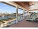 Relax on this inviting outdoor balcony with views of the canal and featuring comfortable lounge chairs at 1930 Kansas Ne Ave, St Petersburg, FL 33703