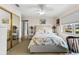 Bright bedroom featuring a ceiling fan, comfortable bed, and closet space at 1930 Kansas Ne Ave, St Petersburg, FL 33703