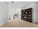 Bright and airy loft space showcasing beautiful chandelier and dark wood bookcase at 1930 Kansas Ne Ave, St Petersburg, FL 33703