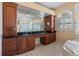 Beautiful main bathroom featuring dual sinks, custom cabinets, and a jetted tub at 1930 Kansas Ne Ave, St Petersburg, FL 33703