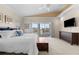 Large main bedroom boasts a private balcony, large windows, and ensuite bathroom at 1930 Kansas Ne Ave, St Petersburg, FL 33703