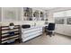 Home office with modern built-in desk and shelving providing ample storage at 1930 Kansas Ne Ave, St Petersburg, FL 33703