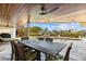 Outdoor dining area with a dark wood dining table and a view of the pool and canal for a great entertaining space at 1930 Kansas Ne Ave, St Petersburg, FL 33703