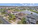 Beautiful aerial view of the neighborhood with mature trees, a pond, and a glimpse of the community at 19429 Paddock View Dr, Tampa, FL 33647