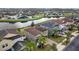 Aerial view of the homes showing well manicured lawns and proximity to the neighborhood lake at 19429 Paddock View Dr, Tampa, FL 33647