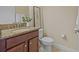 Bathroom featuring granite countertop, modern fixtures, and decorative accents at 19429 Paddock View Dr, Tampa, FL 33647