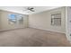 Spacious bedroom offering ample natural light and neutral carpeting at 19429 Paddock View Dr, Tampa, FL 33647