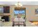 Light-filled dining space with modern chandelier and sliding door to the porch, offering pleasant views of the backyard at 19429 Paddock View Dr, Tampa, FL 33647