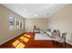 Cozy living room bathed in natural light, featuring hardwood floors and comfortable seating arrangement at 19429 Paddock View Dr, Tampa, FL 33647