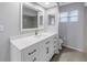 Bathroom featuring a quartz countertop, storage cabinets, and a neutrally painted interior at 2609 Ridge Ln, Palm Harbor, FL 34684