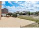 Spacious backyard featuring a large patio, partial fence and view of the neighborhood at 2619 Ravendale Ln, Holiday, FL 34691