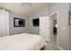 Simple bedroom with neutral walls, light floors, a ceiling fan, and a closet at 2619 Ravendale Ln, Holiday, FL 34691