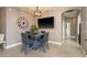 Modern dining area complete with contemporary light fixtures and flows seamlessly to other living spaces at 2619 Ravendale Ln, Holiday, FL 34691