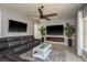 Cozy living room features a stone accent wall with a fireplace and a comfortable seating area for relaxation at 2619 Ravendale Ln, Holiday, FL 34691