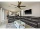 Spacious living room adjacent to the kitchen, featuring tile flooring and an open layout for easy entertainment at 2619 Ravendale Ln, Holiday, FL 34691