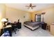 Bedroom featuring a ceiling fan, window, and white tile floor at 3037 Crest Dr, Clearwater, FL 33759