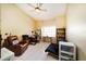 Bedroom featuring tile flooring, a ceiling fan, and natural light at 3037 Crest Dr, Clearwater, FL 33759