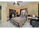 Bedroom featuring tile floors, a ceiling fan, and a closet for storage at 3037 Crest Dr, Clearwater, FL 33759