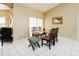 Dining space with a glass-top table, tile flooring, and natural light at 3037 Crest Dr, Clearwater, FL 33759