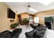 Living room with tile flooring, a stone fireplace, skylights, and comfortable seating at 3037 Crest Dr, Clearwater, FL 33759