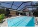 Screened-in pool with a spacious deck and backyard at 3037 Crest Dr, Clearwater, FL 33759