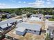 Aerial view of the home showing the roof, yard, and surrounding neighborhood at 3246 Thorny Ridge Dr, Holiday, FL 34691