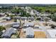 Neighborhood aerial shows home with new roof, concrete driveway, and proximity to local amenities at 3246 Thorny Ridge Dr, Holiday, FL 34691