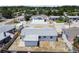 Drone view of the home showing the roof, backyard, and surrounding neighborhood at 3246 Thorny Ridge Dr, Holiday, FL 34691