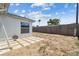 Backyard with stone tile detail and wood fence at 3246 Thorny Ridge Dr, Holiday, FL 34691