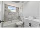 This bathroom features tiled shower/tub, with new vanity with brushed nickel hardware, and new plumbing fixtures at 3246 Thorny Ridge Dr, Holiday, FL 34691