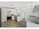 Bright kitchen features stainless steel appliances, gray marbled granite counters, and white cabinetry at 3246 Thorny Ridge Dr, Holiday, FL 34691