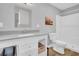 Bathroom featuring a vanity with drawers, framed mirror, and walk-in shower at 3373 Brodie Way, Palm Harbor, FL 34684