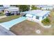 Aerial view of a single-story residence with a carport and manicured landscaping at 36947 Beth Ave, Zephyrhills, FL 33542