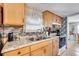 Bright kitchen with stainless steel sink, granite countertops, and modern backsplash at 36947 Beth Ave, Zephyrhills, FL 33542