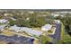 Aerial view of the condominium complex, highlighting the lush surroundings and convenient parking at 4215 E Bay Dr # 900, Clearwater, FL 33764