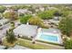 Aerial view of a community pool surrounded by lush trees, providing a relaxing atmosphere at 4215 E Bay Dr # 900, Clearwater, FL 33764